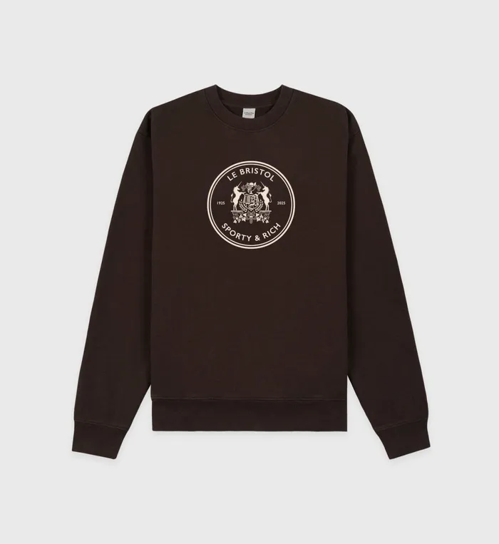 Sporty and Rich Sweatshirts Women Bristol Crest 100th Crewneck 8211 ChocolateCream Sporty and Rich Sweatshirts Women Bristol Crest 100th Crewneck 8211 ChocolateCream