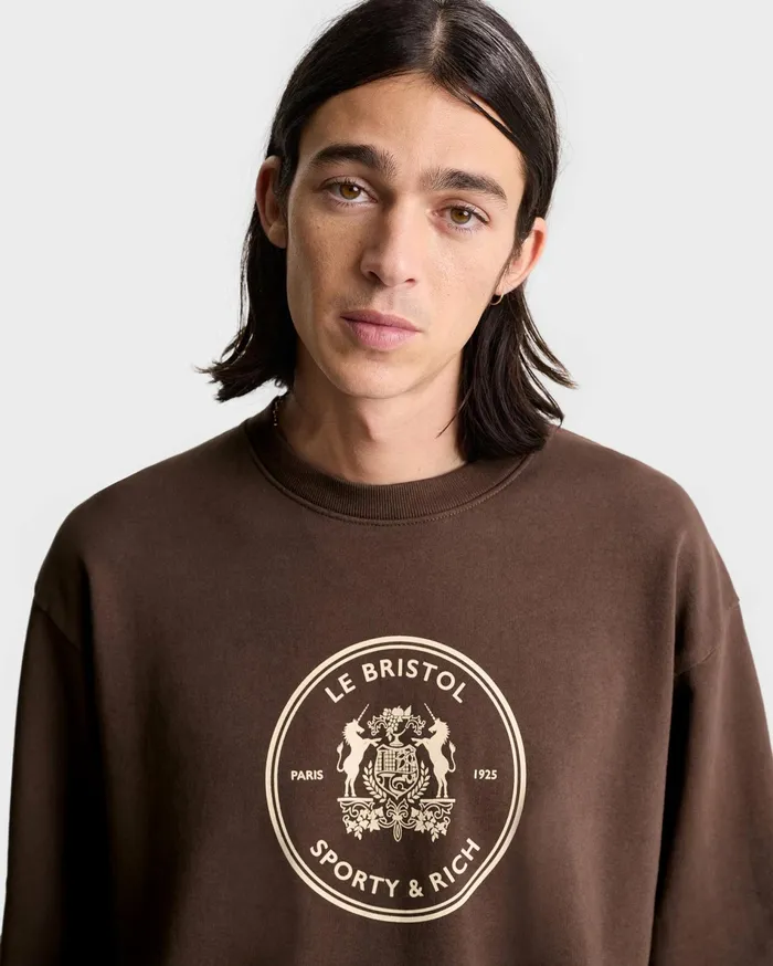 Sporty and Rich Sweatshirts Women Bristol Crest 100th Crewneck 8211 ChocolateCream