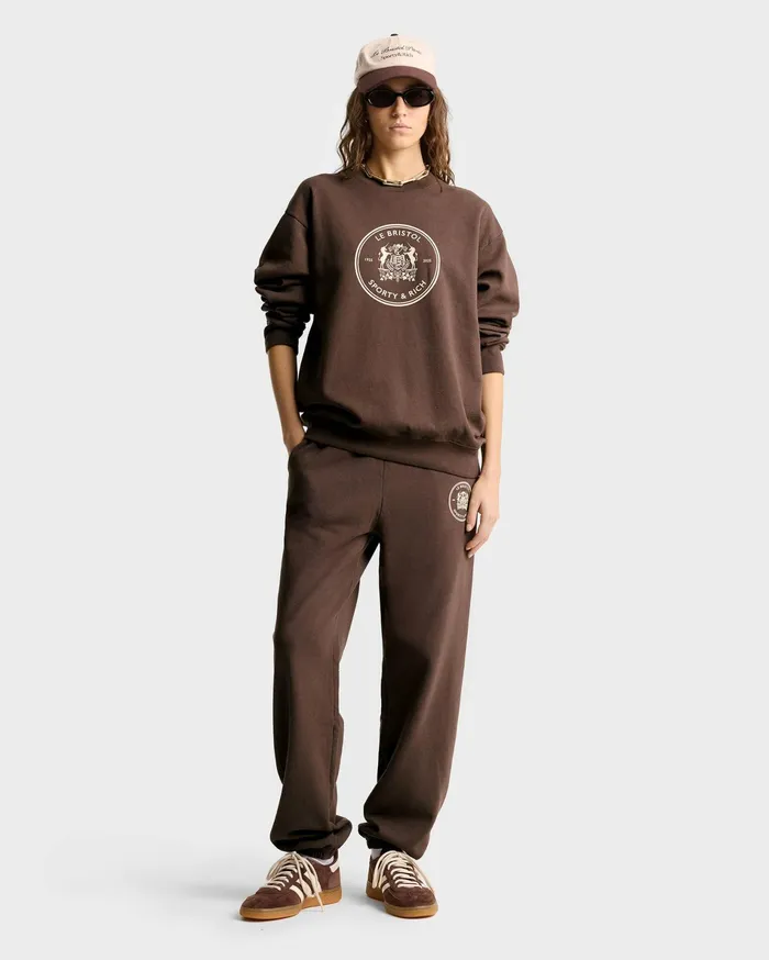 Sporty and Rich Sweatshirts Women Bristol Crest 100th Crewneck 8211 ChocolateCream