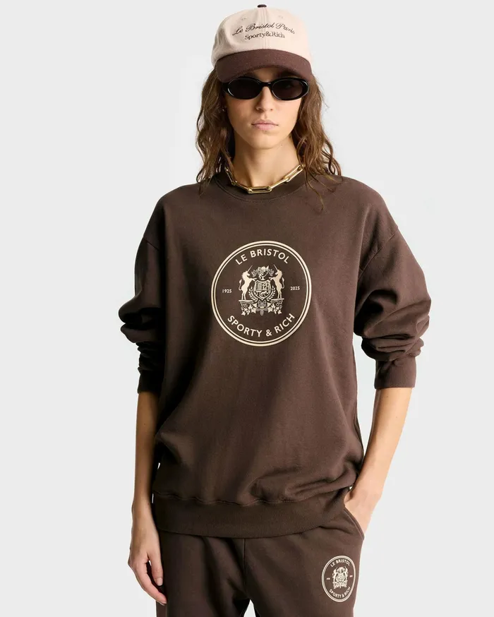 Sporty and Rich Sweatshirts Women Bristol Crest 100th Crewneck 8211 ChocolateCream