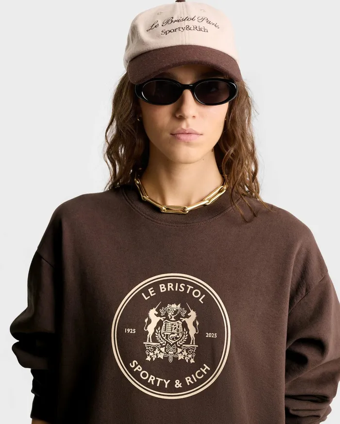 Sporty and Rich Sweatshirts Women Bristol Crest 100th Crewneck 8211 ChocolateCream